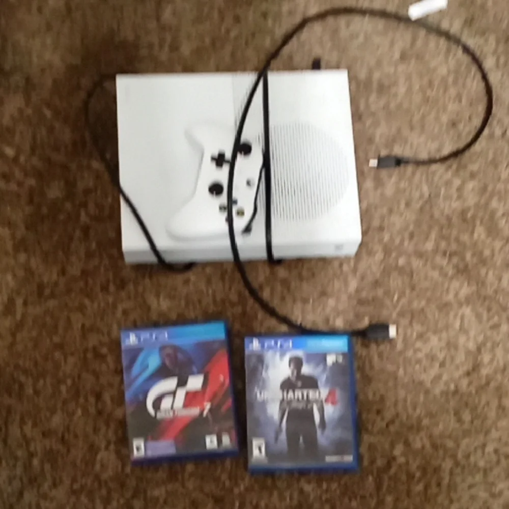 Xbox One S system with PlayStation 4 games